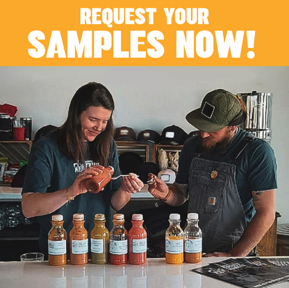 Two people standing behind a counter with several small sauce bottles lined up in front, holding small containers and tasting. A large orange banner at the top reads 'REQUEST YOUR SAMPLES NOW!'.